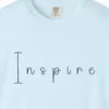 inspire-hand-drawn-tee-chambray-chest Close-up of the Inspire Hand-Drawn print on a Chambray Comfort Colors 1717 tee