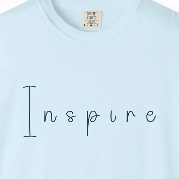 inspire-hand-drawn-tee-chambray-chest Close-up of the Inspire Hand-Drawn print on a Chambray Comfort Colors 1717 tee