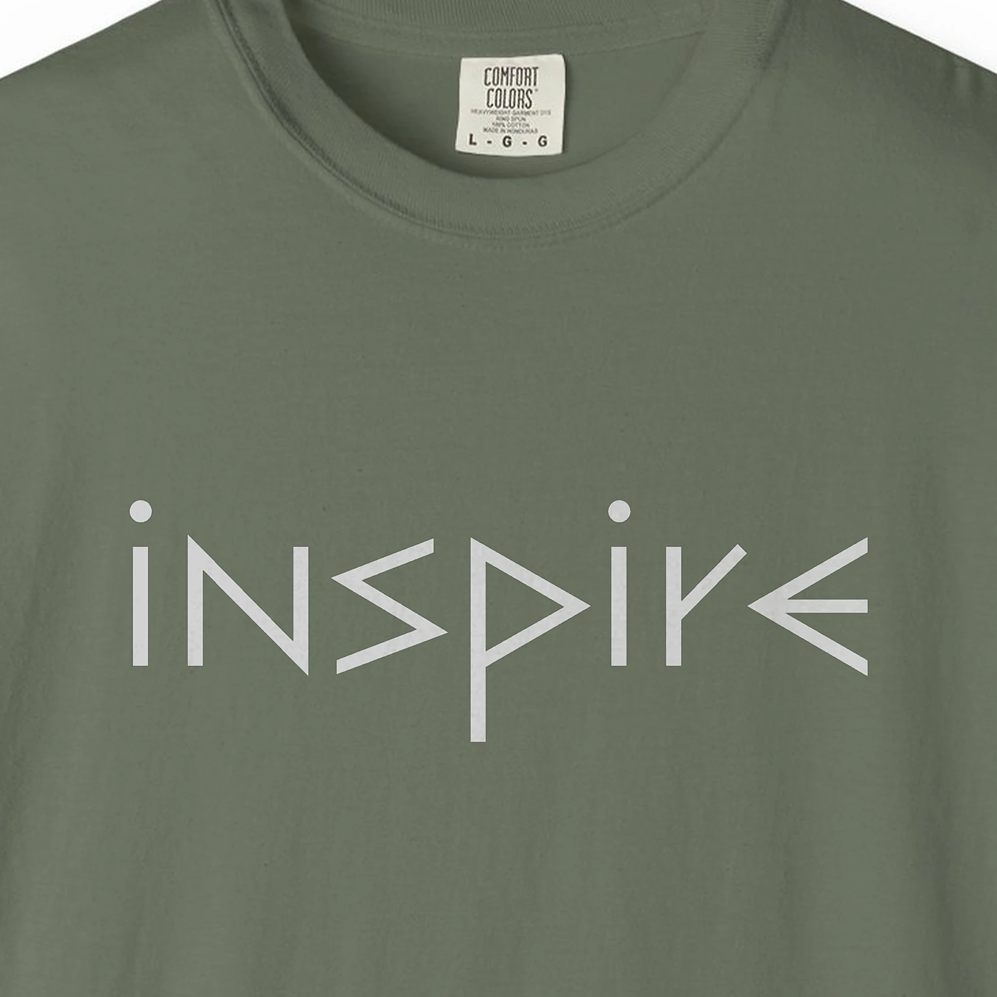 Close-up of the Inspire print on a Moss Comfort Colors 1717 tee