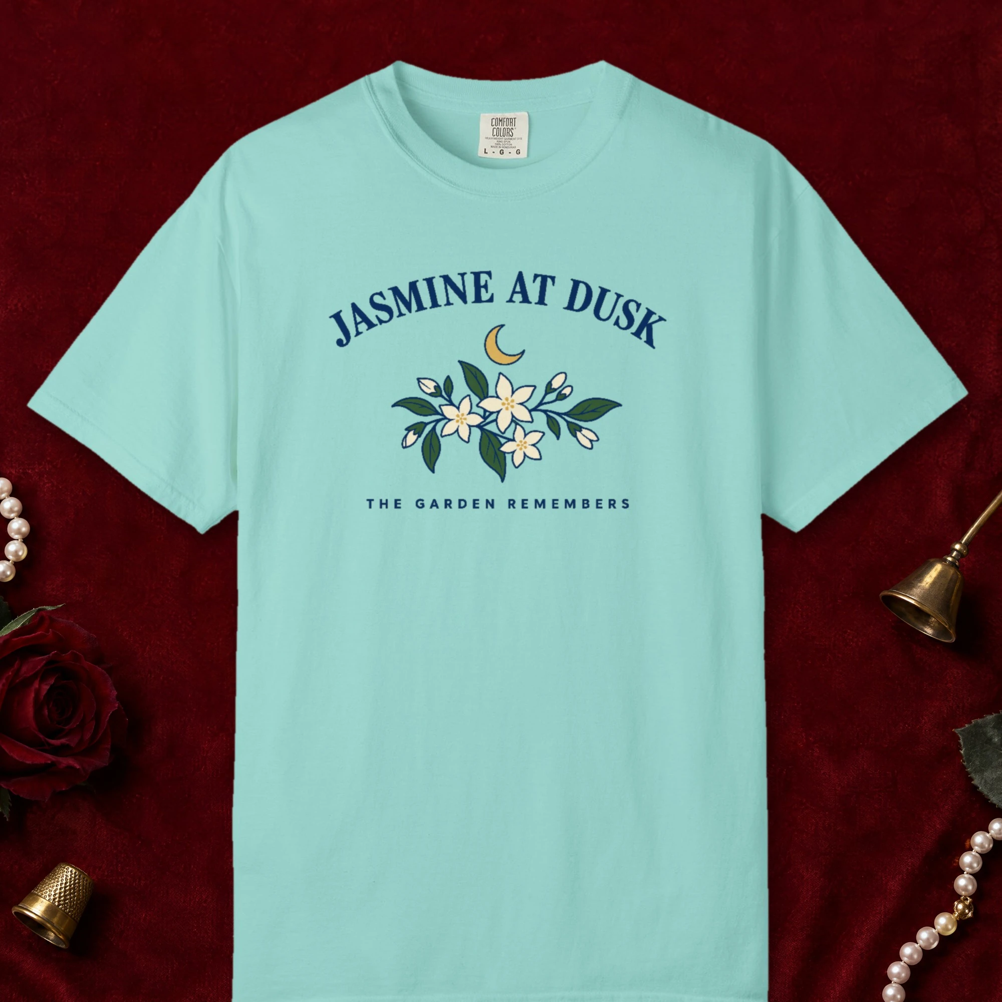 Jasmine at Dusk design on a Chalky Mint Comfort Colors 1717 tee, laid flat