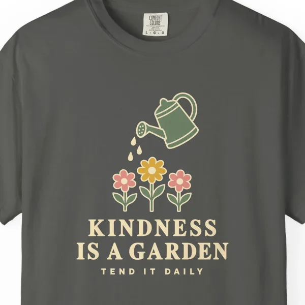 Close-up of the Kindness Is a Garden print on a Pepper Comfort Colors 1717 tee