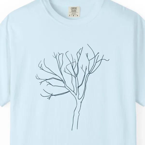 Close-up of the Leaning Bare Tree print on a Chambray Comfort Colors 1717 tee