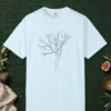 Leaning Bare Tree design on a Chambray Comfort Colors 1717 tee, laid flat