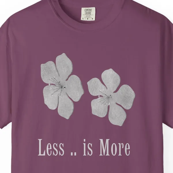 Close-up of the Less Is More Flowers print on a Berry Comfort Colors 1717 tee