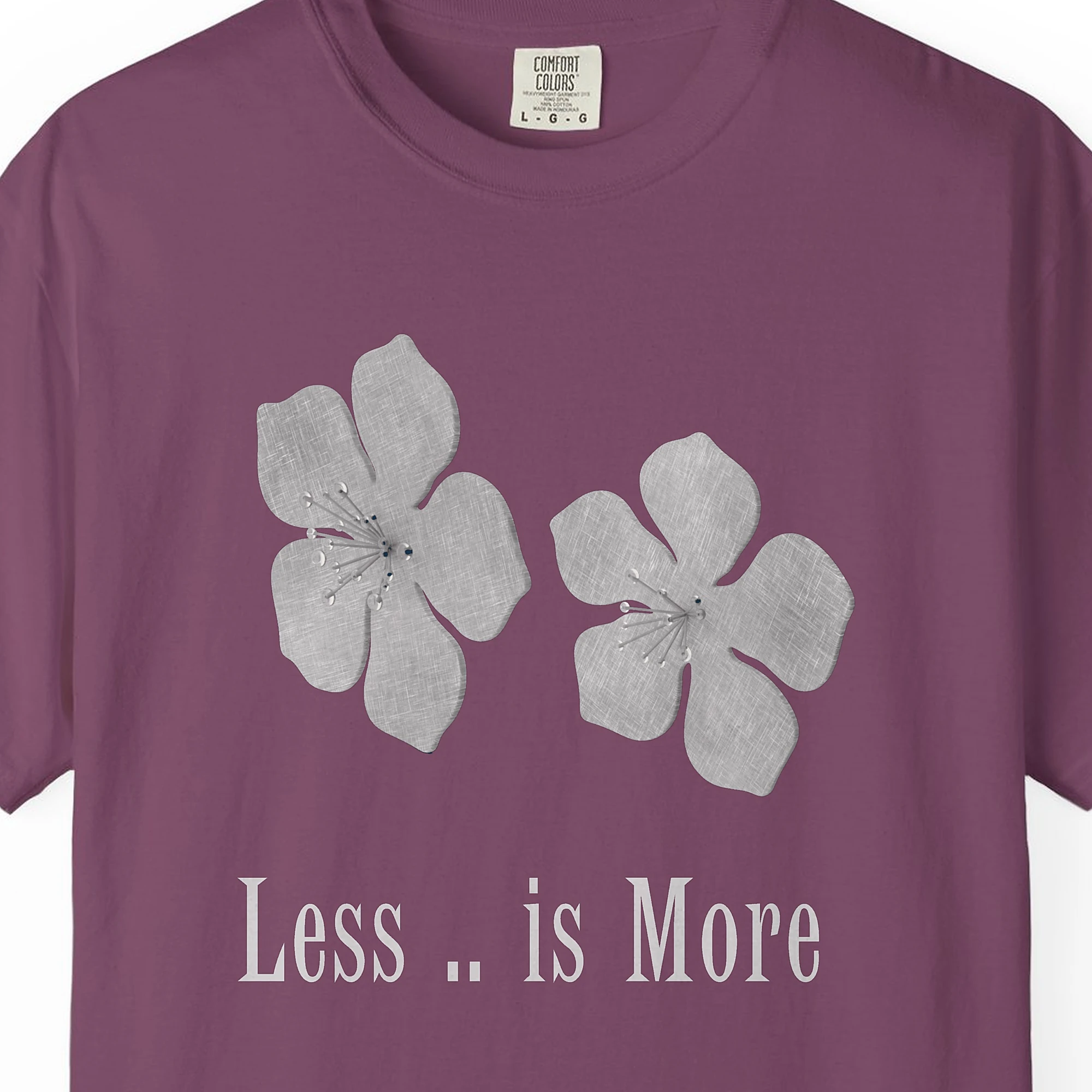 less-is-more-flowers-tee-berry-chest Close-up of the Less Is More Flowers print on a Berry Comfort Colors 1717 tee