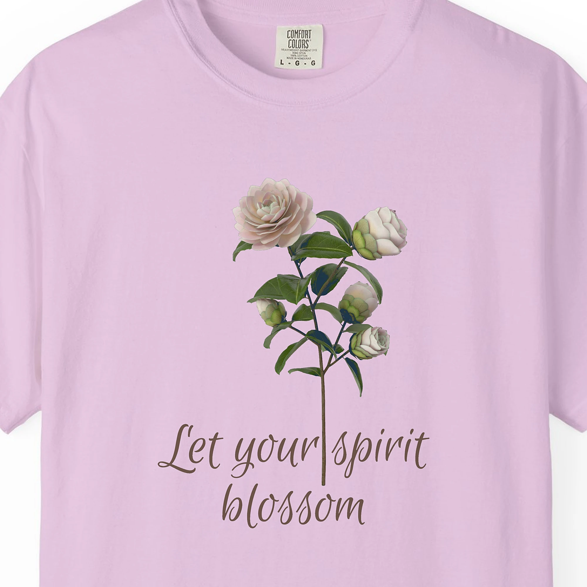 Close-up of the Let Your Spirit Blossom print on a Orchid Comfort Colors 1717 tee
