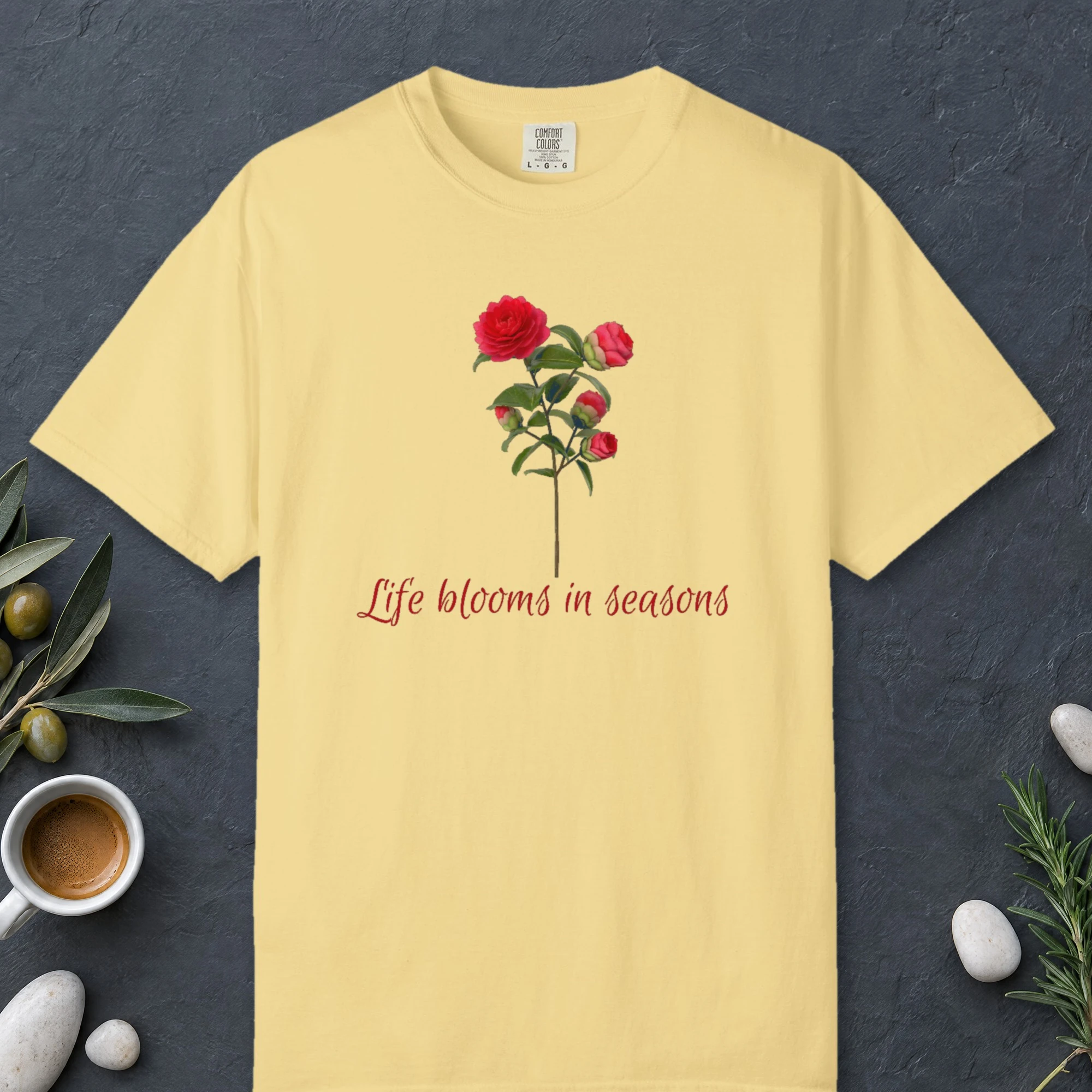 Life Blooms in Seasons design on a Butter Comfort Colors 1717 tee, laid flat