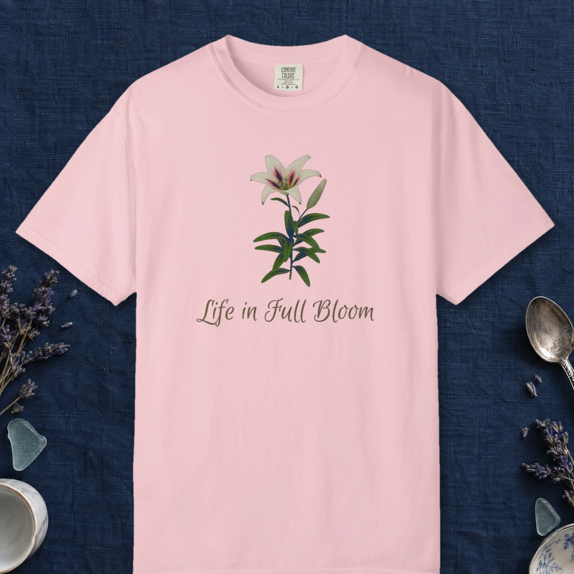 Life in Full Bloom design on a Blossom Comfort Colors 1717 tee, laid flat