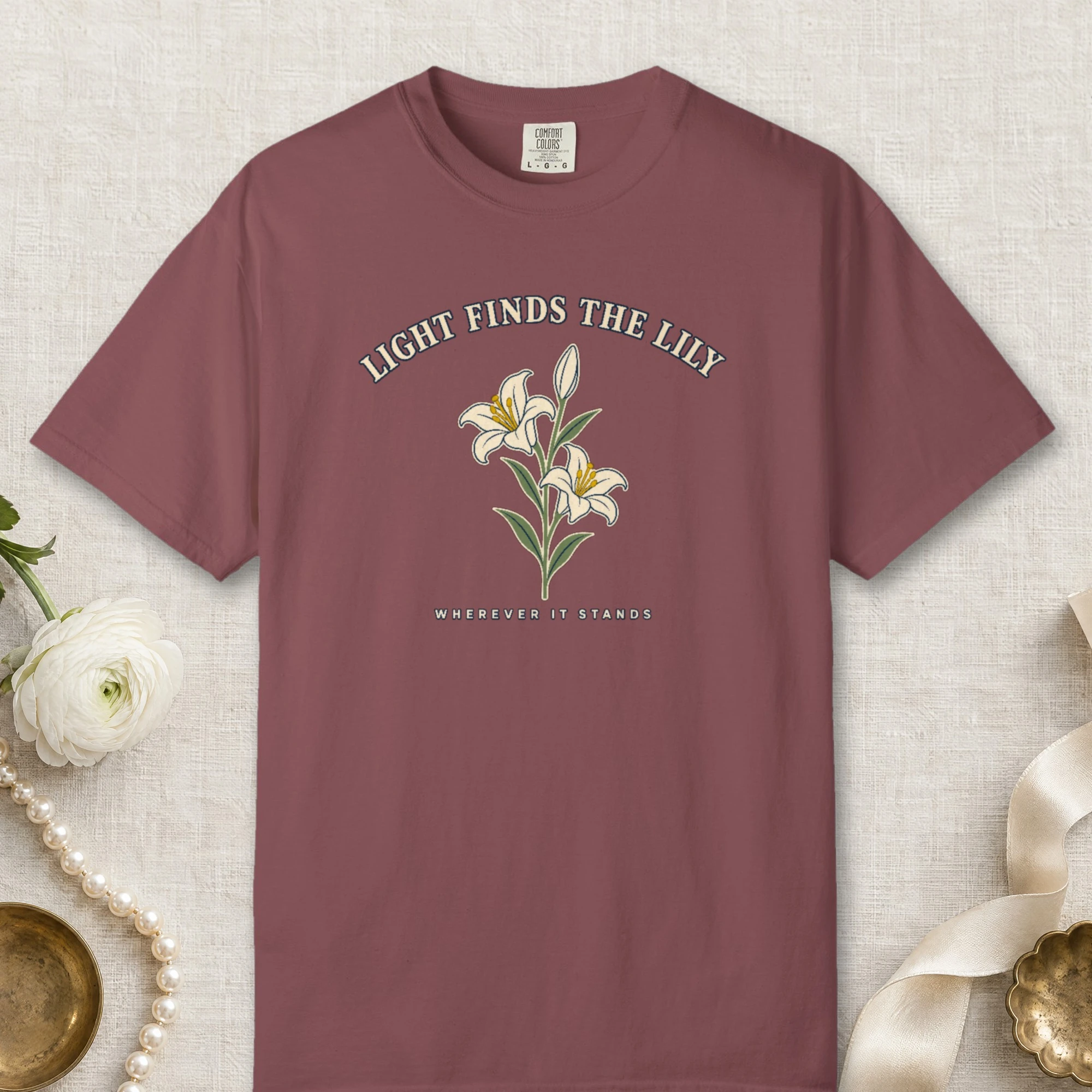 Light Finds the Lily design on a Brick Comfort Colors 1717 tee, laid flat