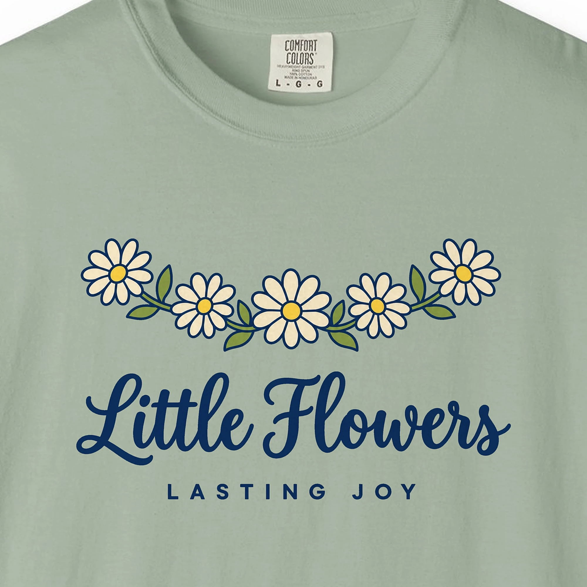 Close-up of the Little Flowers Lasting Joy print on a Bay Comfort Colors 1717 tee