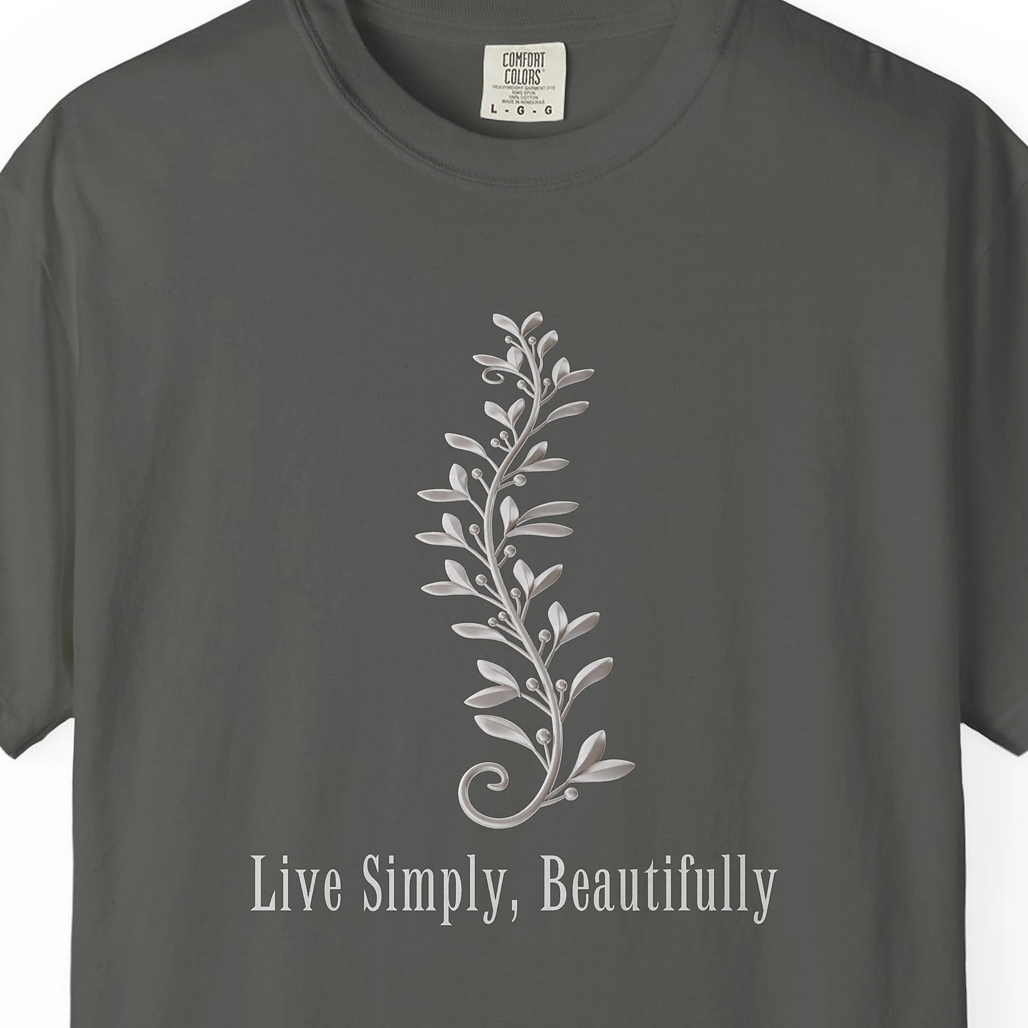 Close-up of the Live Simply Beautifully print on a Pepper Comfort Colors 1717 tee