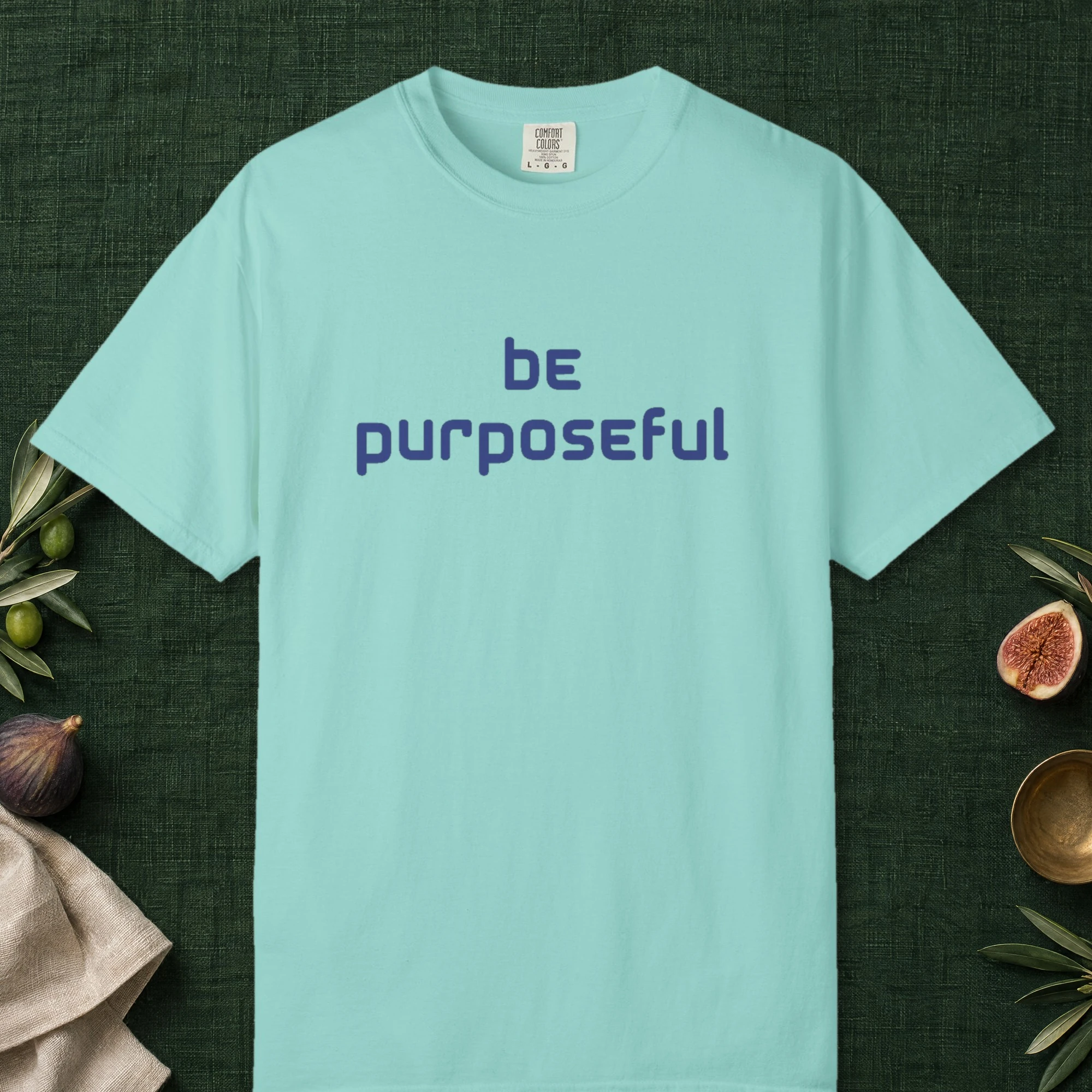 Living with Purpose design on a Chalky Mint Comfort Colors 1717 tee, laid flat
