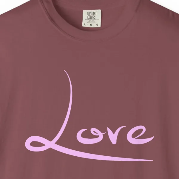 Close-up of the Love print on a Brick Comfort Colors 1717 tee