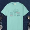 Mighty Trees Grow design on a Chalky Mint Comfort Colors 1717 tee, laid flat
