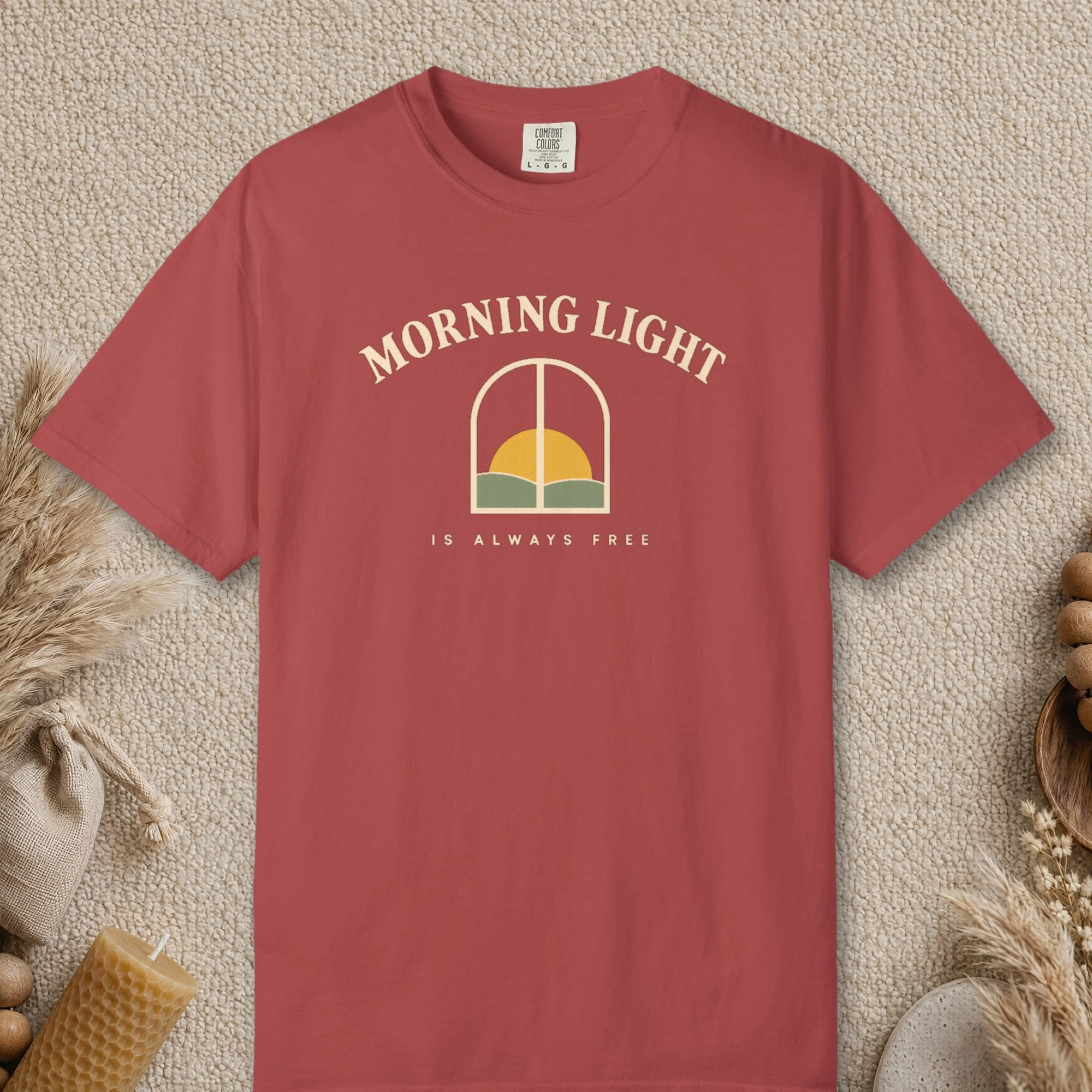 Morning Light Is Always Free design on a Crimson Comfort Colors 1717 tee, laid flat