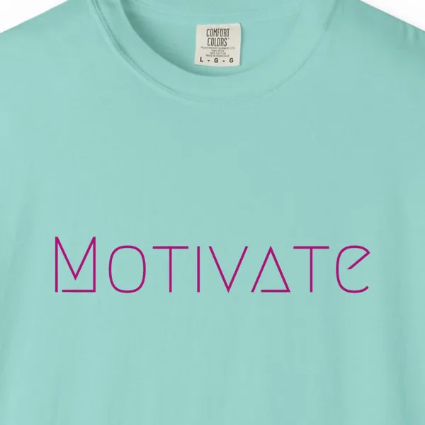 Close-up of the Motivate print on a Chalky Mint Comfort Colors 1717 tee