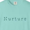Close-up of the Nurture Flared Serif print on a Chalky Mint Comfort Colors 1717 tee