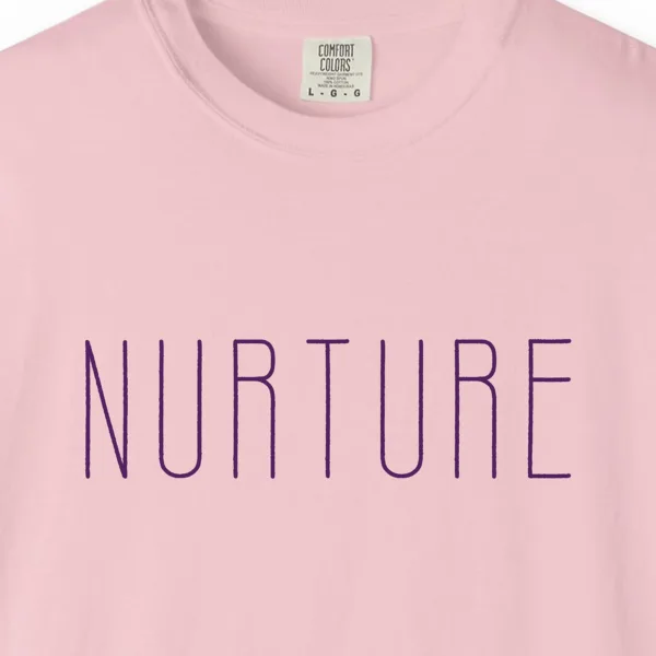 Close-up of the Nurture print on a Blossom Comfort Colors 1717 tee