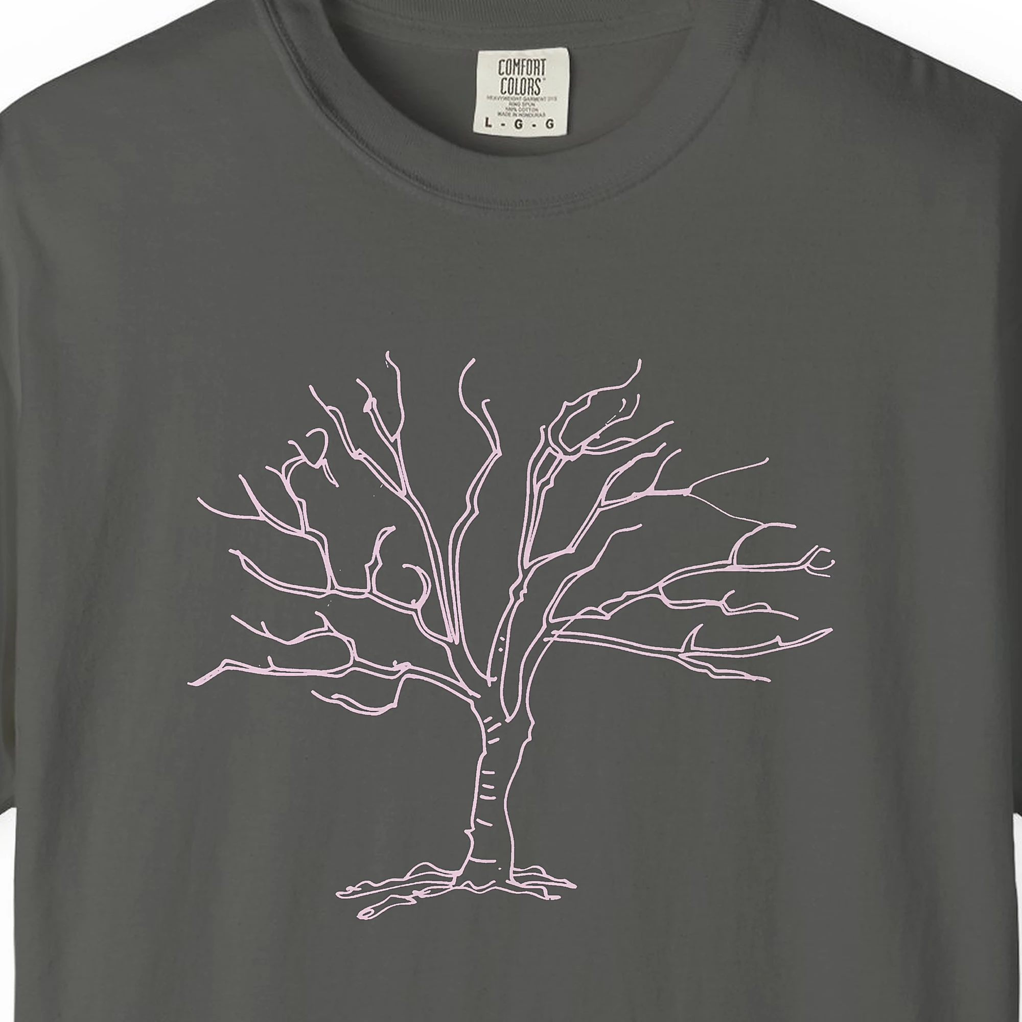 Close-up of the Old Gnarled Tree print on a Pepper Comfort Colors 1717 tee
