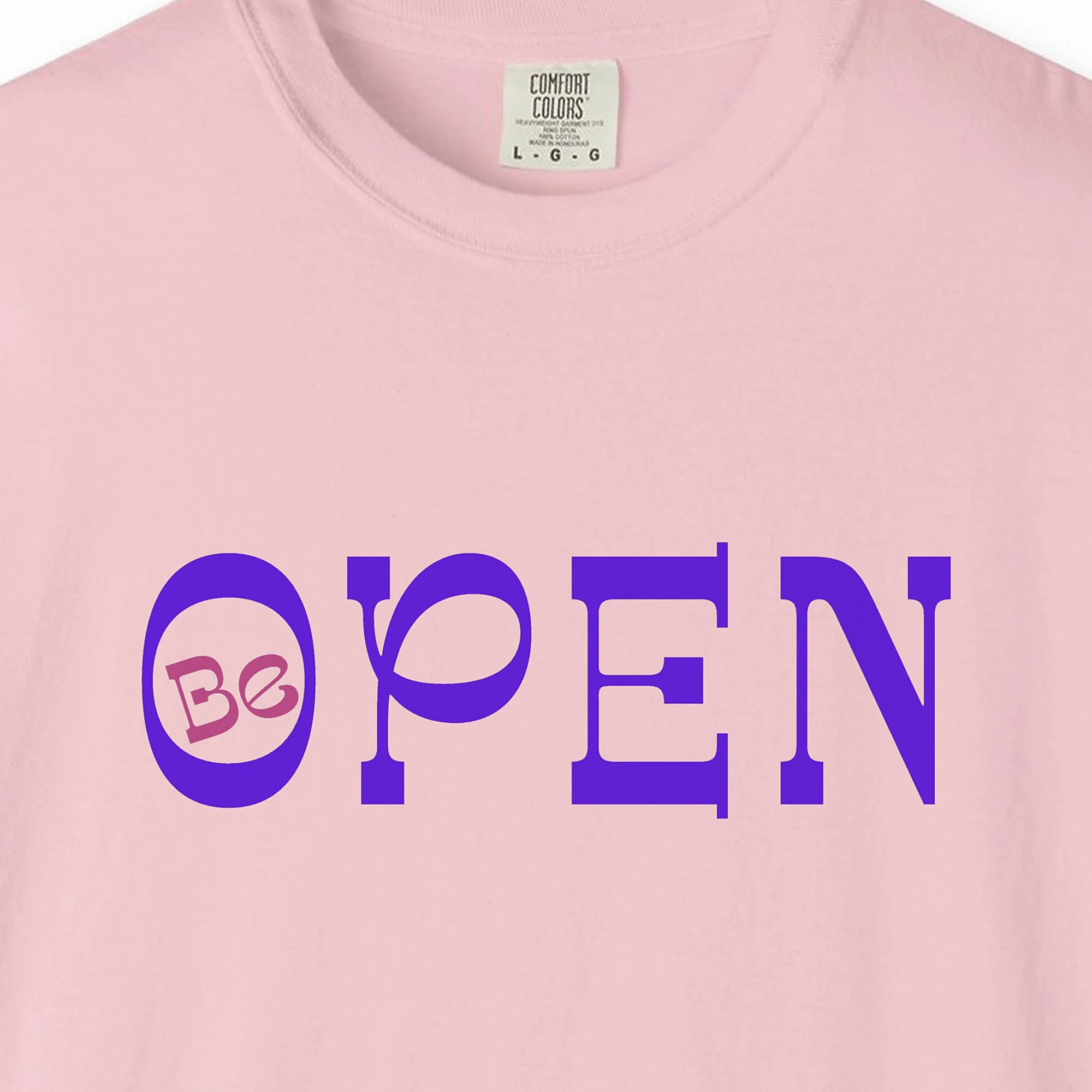 Close-up of the Open to Wonder print on a Blossom Comfort Colors 1717 tee