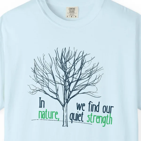our-quiet-strength-tee-chambray-chest Close-up of the Our Quiet Strength print on a Chambray Comfort Colors 1717 tee