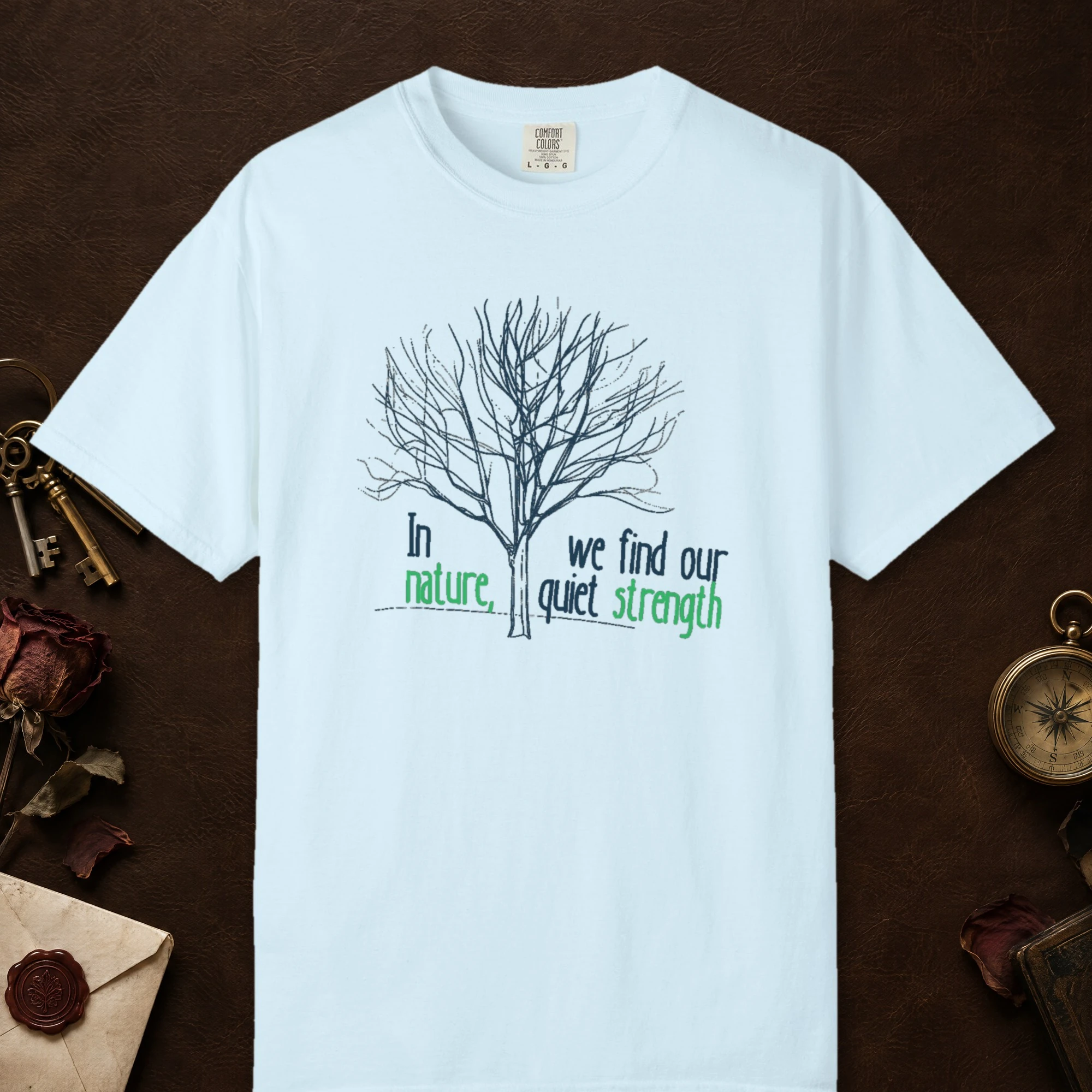 Our Quiet Strength design on a Chambray Comfort Colors 1717 tee, laid flat