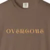 Close-up of the Overcome print on a Espresso Comfort Colors 1717 tee