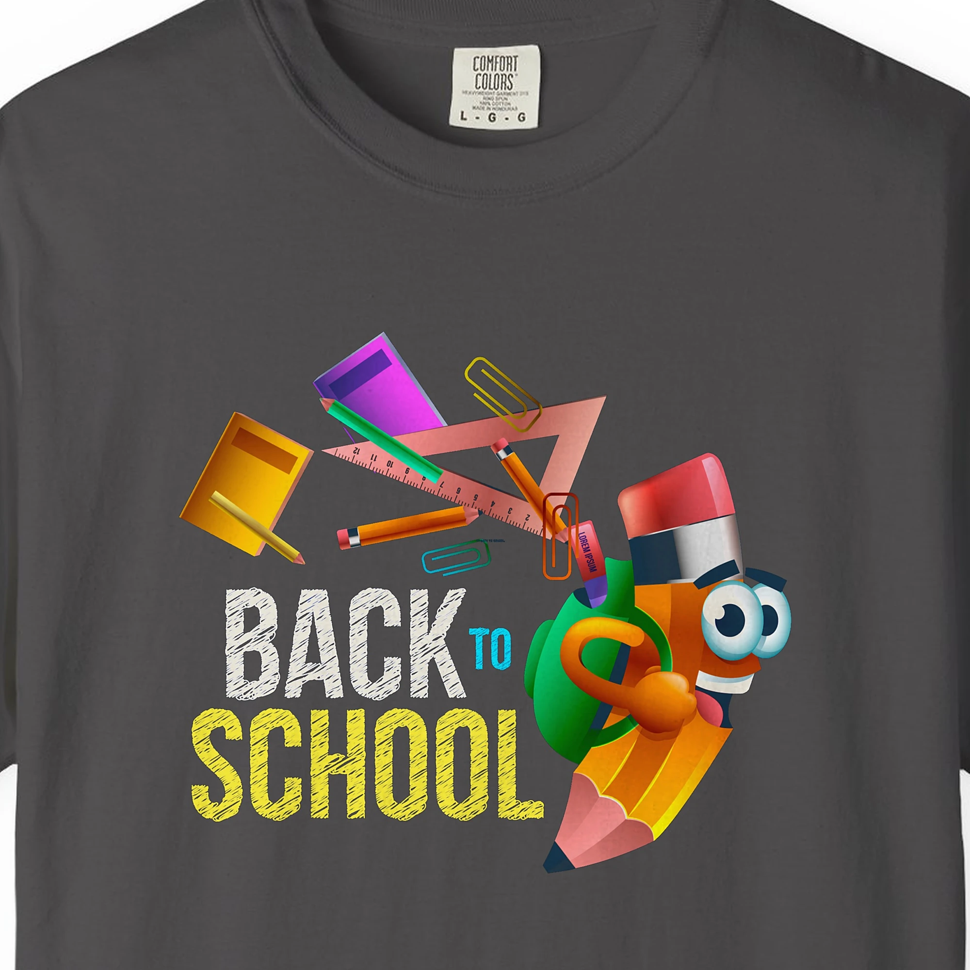 Close-up of the Pencil Buddy print on a Graphite Comfort Colors 1717 tee