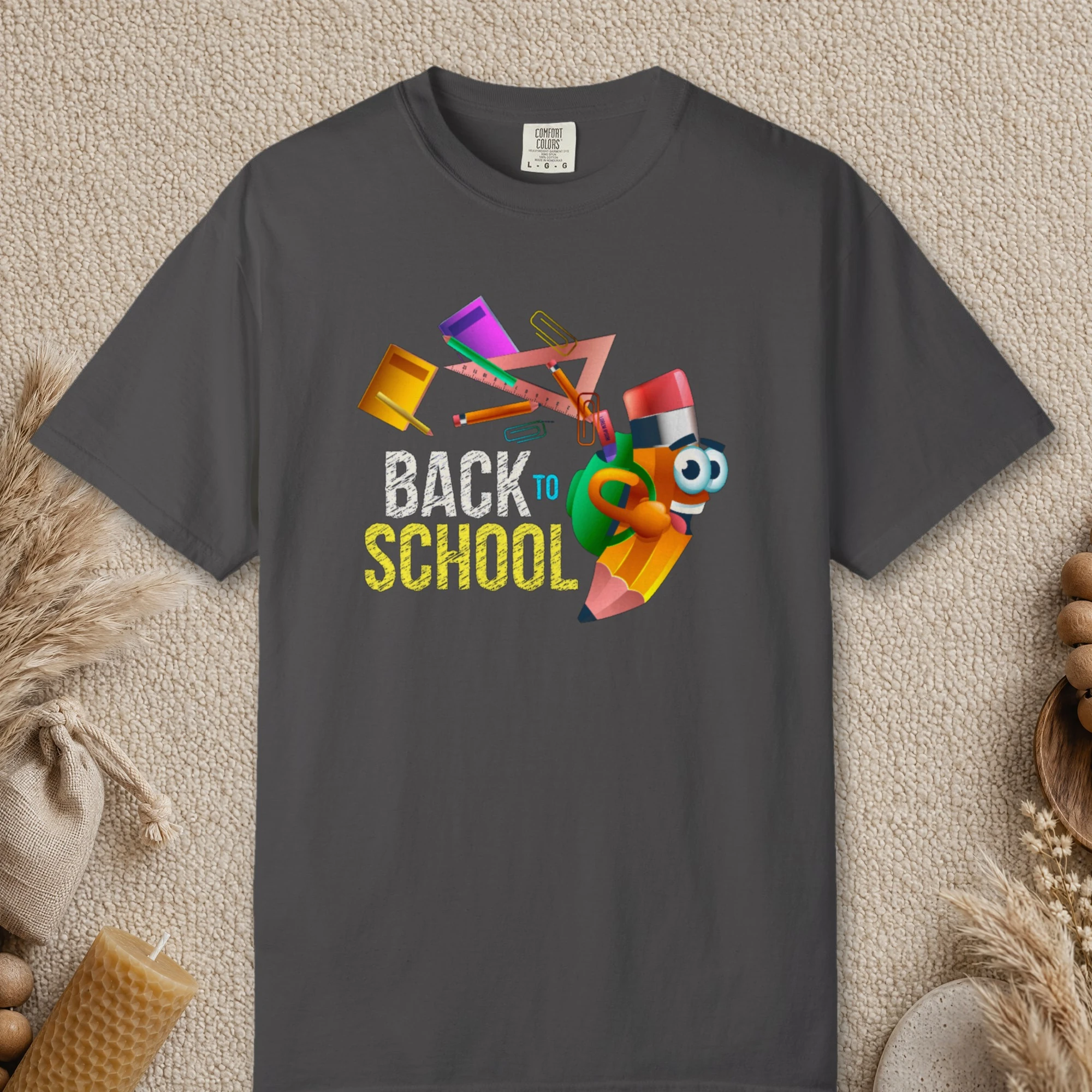 Pencil Buddy design on a Graphite Comfort Colors 1717 tee, laid flat