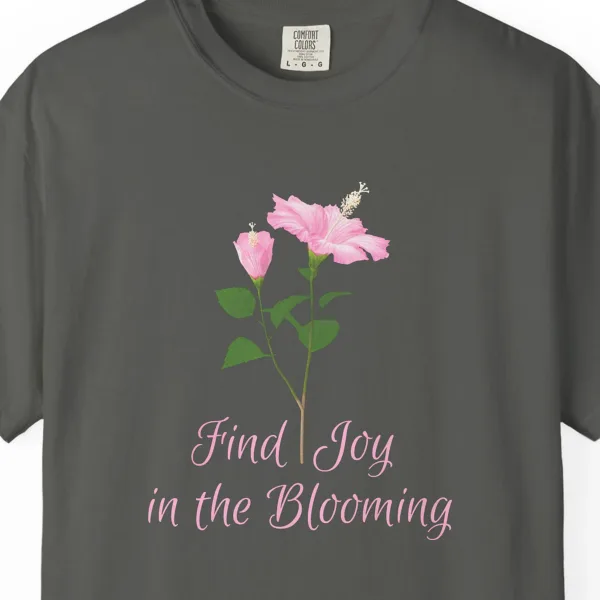 Close-up of the Pink Hibiscus Joy print on a Pepper Comfort Colors 1717 tee