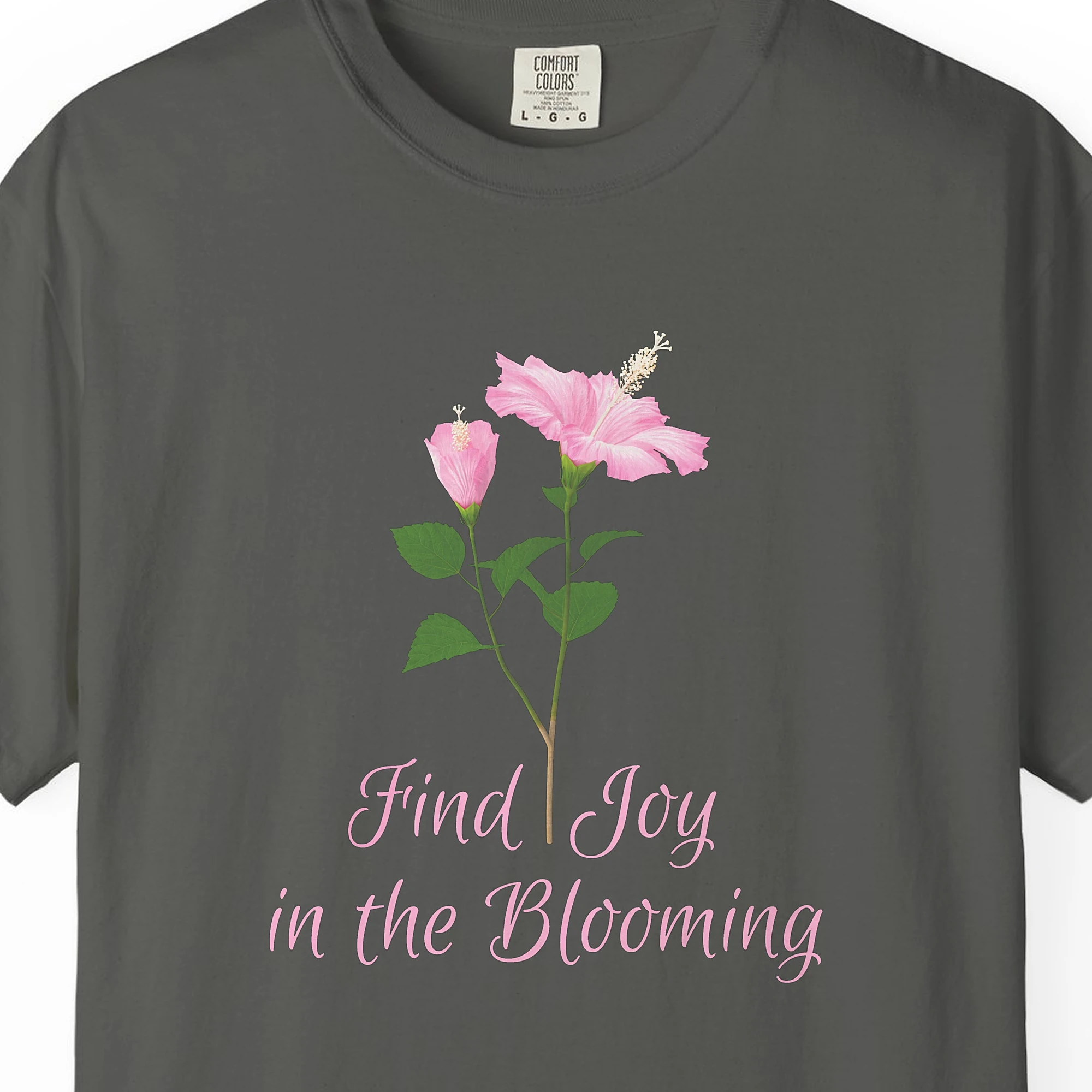 Close-up of the Pink Hibiscus Joy print on a Pepper Comfort Colors 1717 tee
