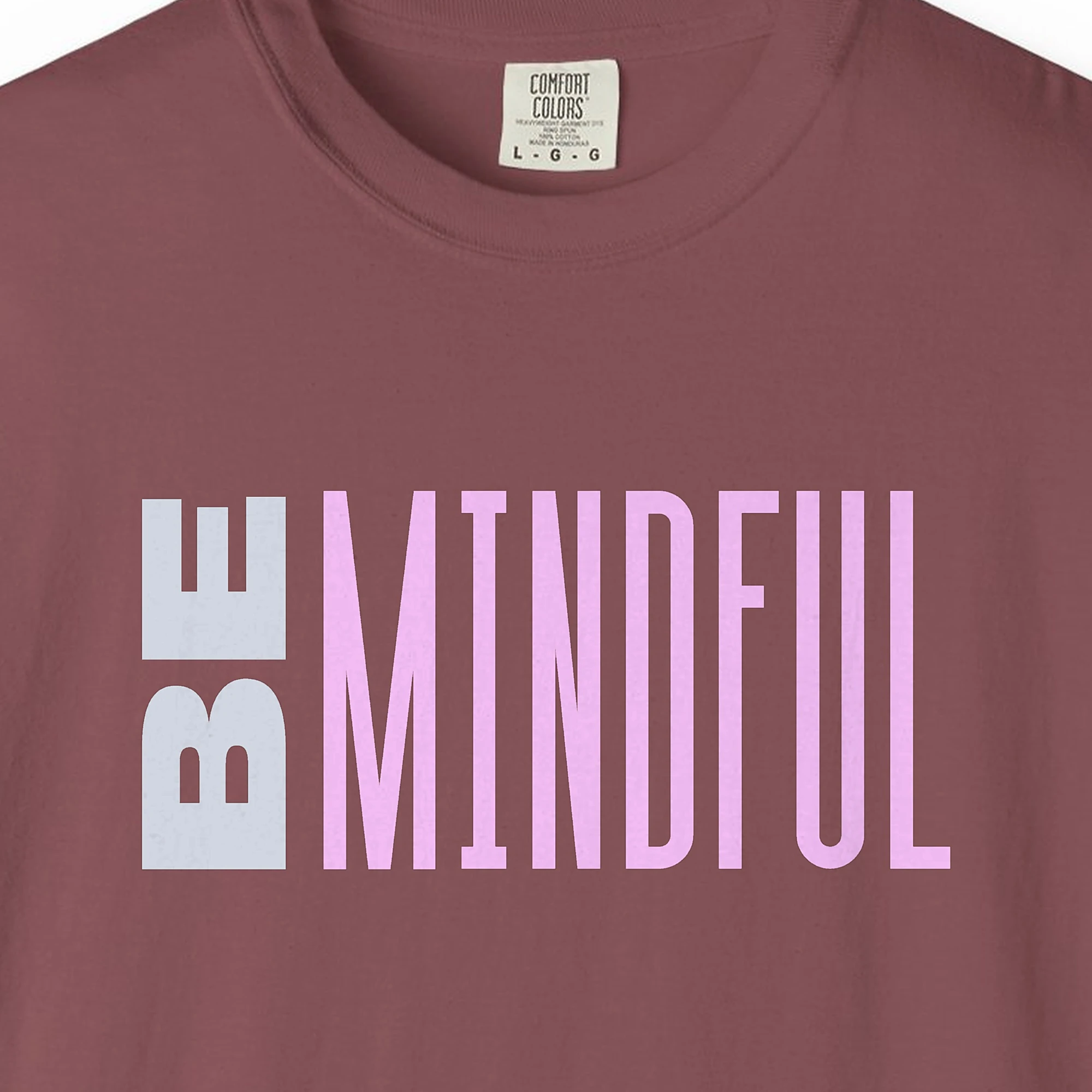 Close-up of the Present Moment print on a Brick Comfort Colors 1717 tee