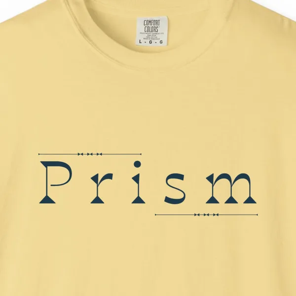 Close-up of the Prism Slab Serif print on a Butter Comfort Colors 1717 tee