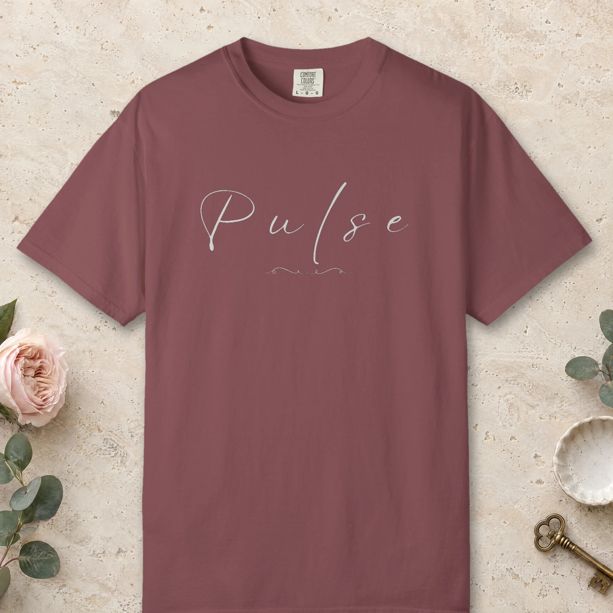 Pulse in Flowing Hand design on a Brick Comfort Colors 1717 tee, laid flat