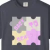 Close-up of the Puzzle Pieces School print on a Navy Comfort Colors 1717 tee