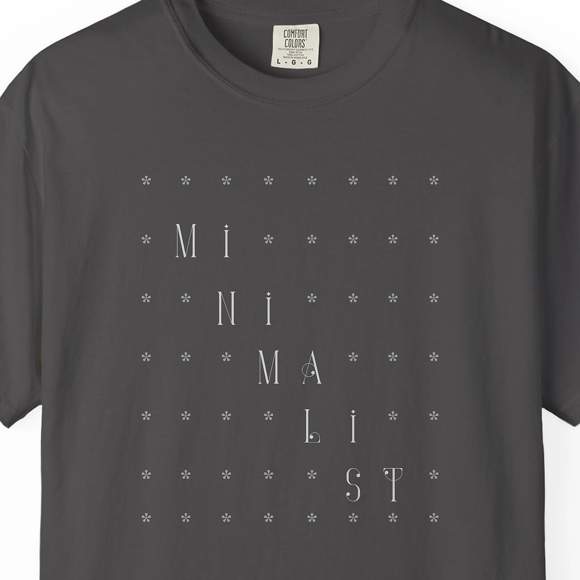 Close-up of the Quiet Grid print on a Graphite Comfort Colors 1717 tee
