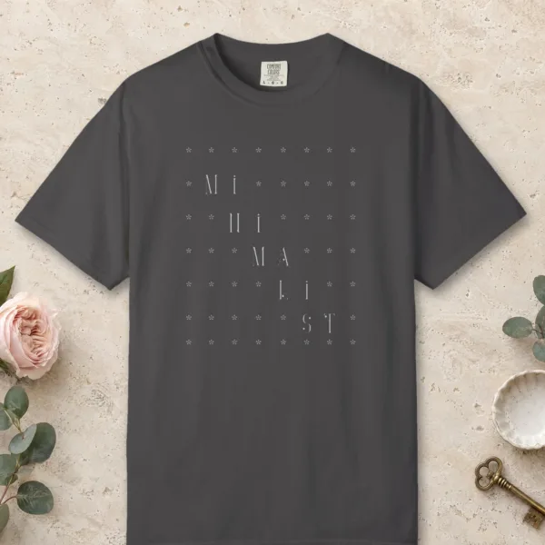 Quiet Grid design on a Graphite Comfort Colors 1717 tee, laid flat