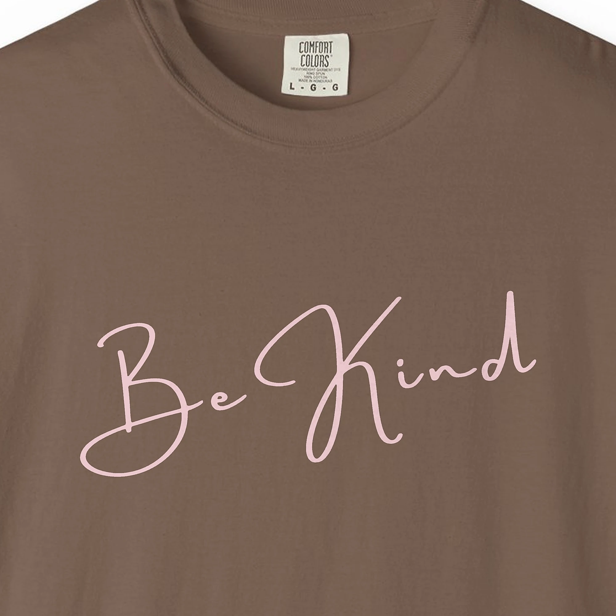 Close-up of the Quiet Kindness print on a Espresso Comfort Colors 1717 tee