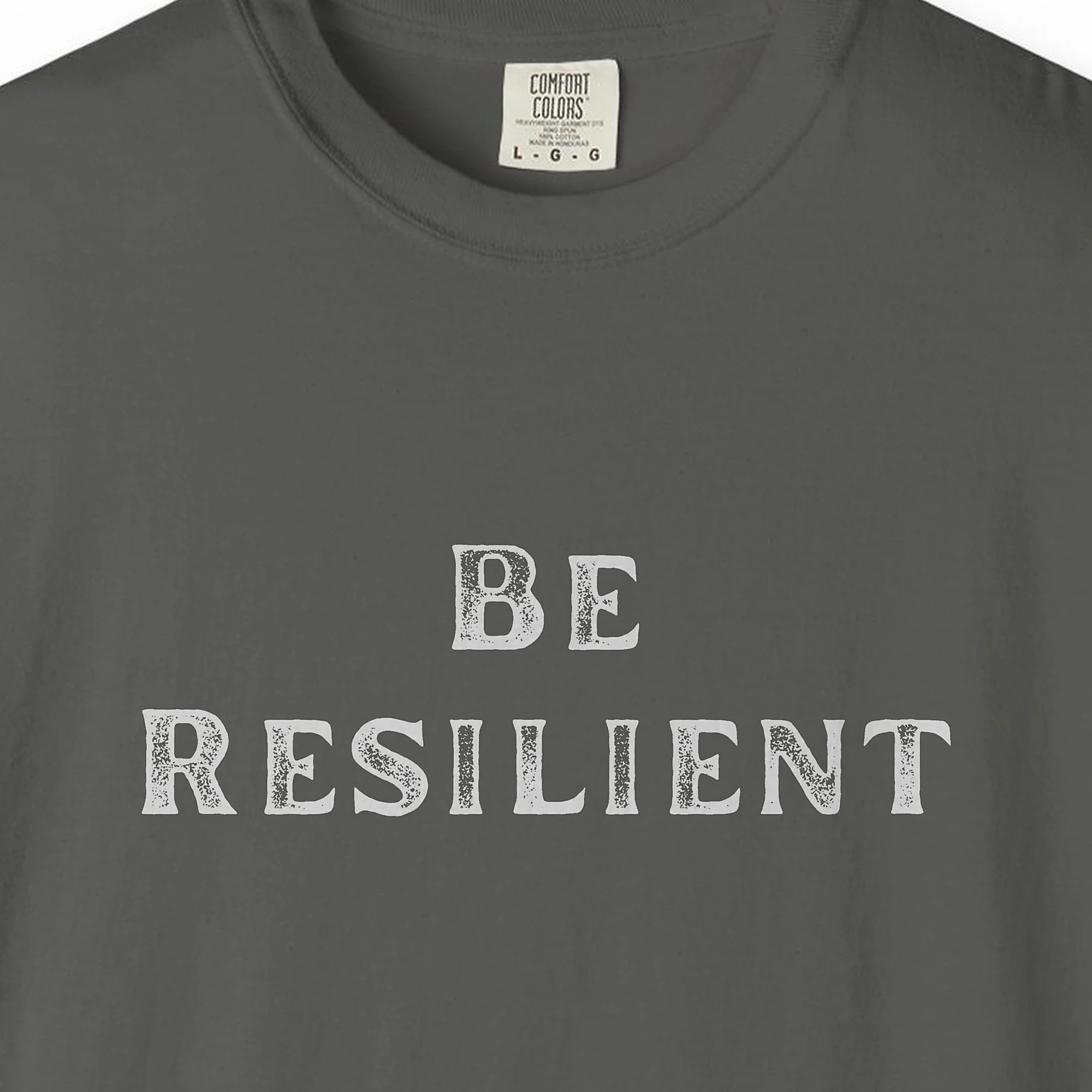 Close-up of the Quiet Resilience print on a Pepper Comfort Colors 1717 tee