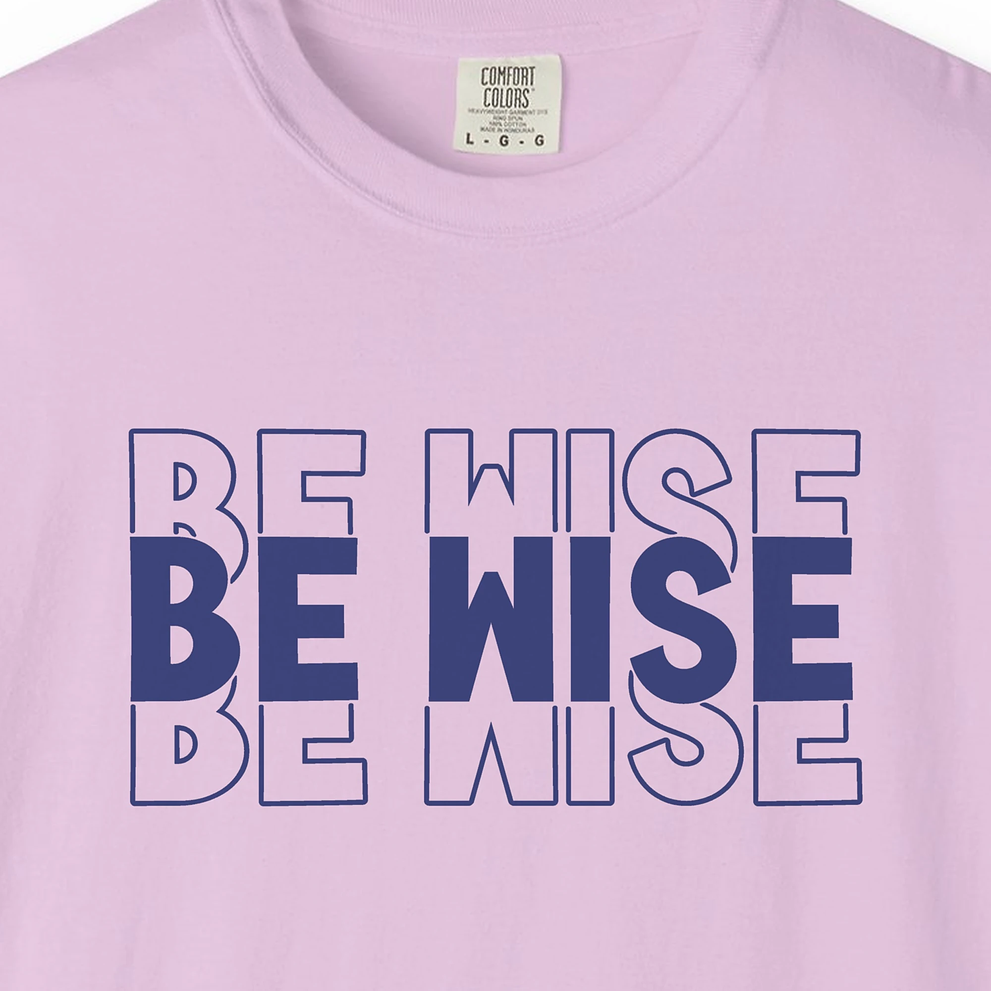 quiet-wisdom-tee-orchid-chest Close-up of the Quiet Wisdom print on a Orchid Comfort Colors 1717 tee