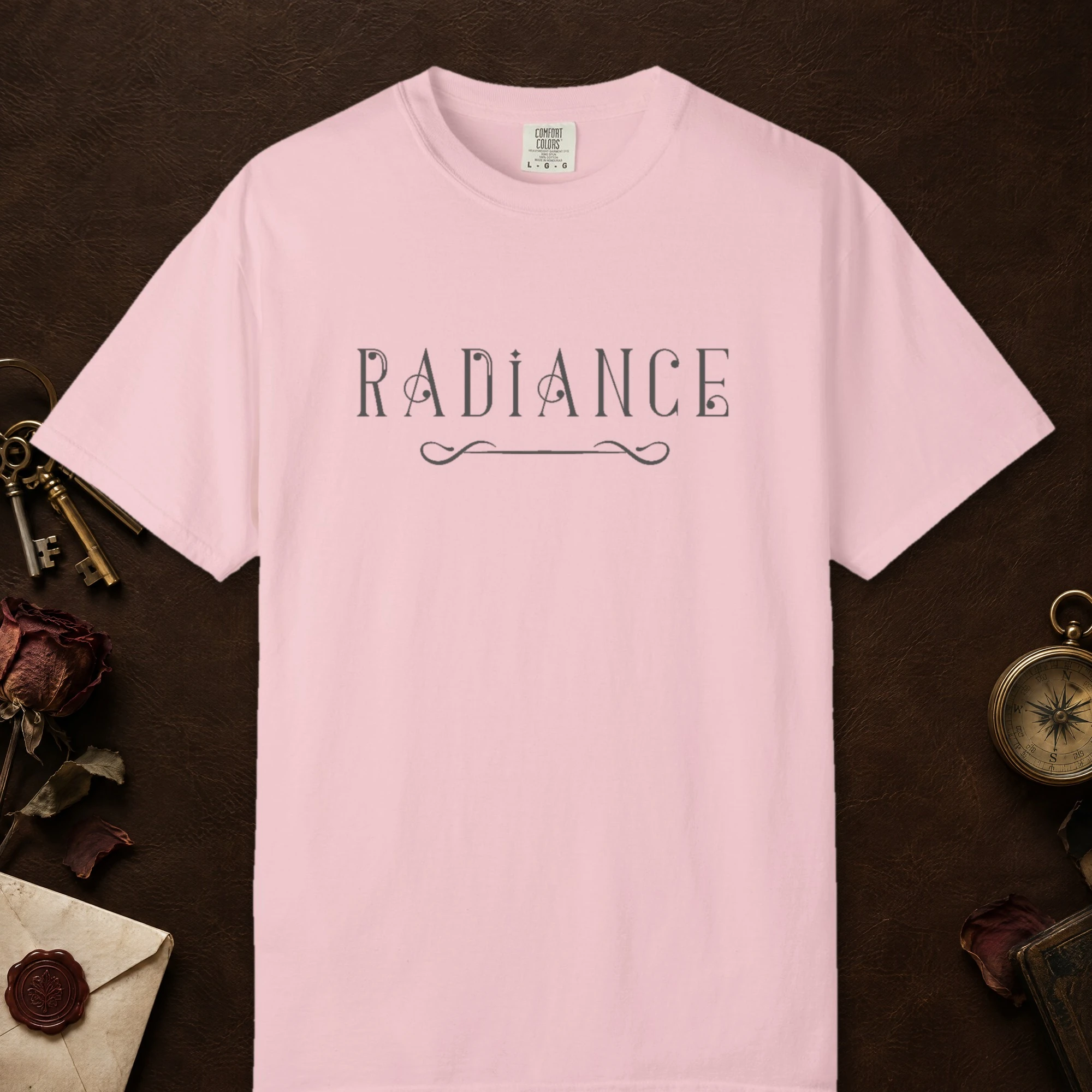 Radiance Deco design on a Blossom Comfort Colors 1717 tee, laid flat