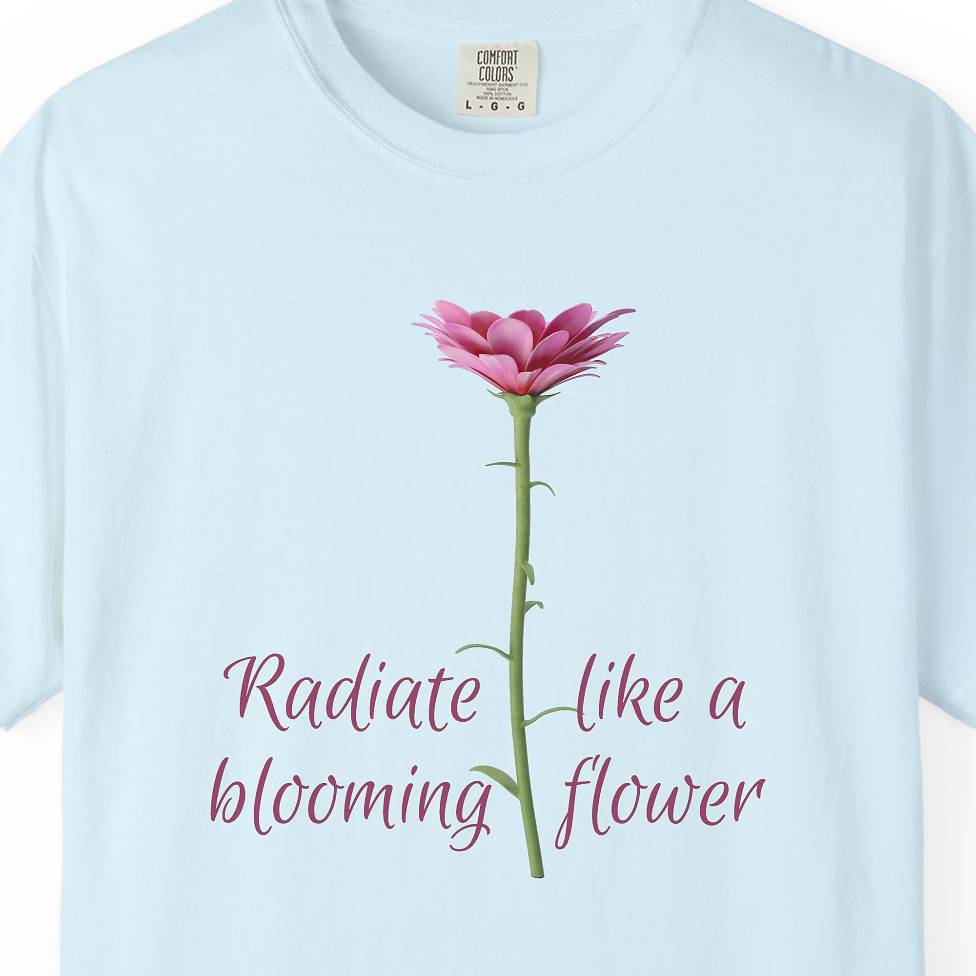 Close-up of the Radiate Like a Flower print on a Chambray Comfort Colors 1717 tee