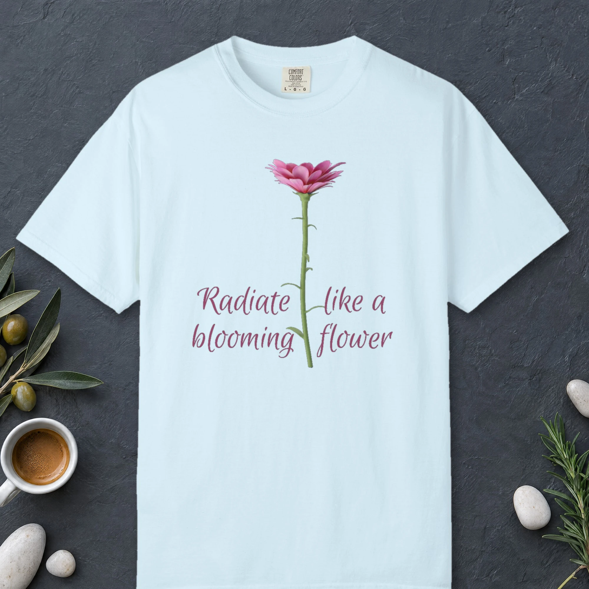 Radiate Like a Flower design on a Chambray Comfort Colors 1717 tee, laid flat