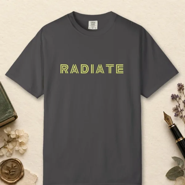 Radiate design on a Graphite Comfort Colors 1717 tee, laid flat
