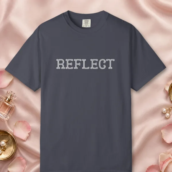 Reflect design on a Navy Comfort Colors 1717 tee, laid flat