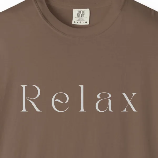 Close-up of the Relax Display Serif print on a Espresso Comfort Colors 1717 tee