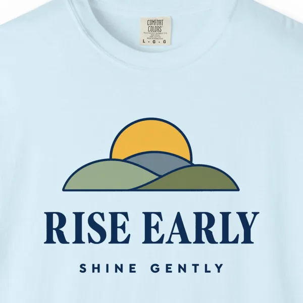Close-up of the Rise Early Shine Gently print on a Chambray Comfort Colors 1717 tee