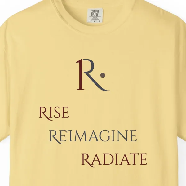 rise-reimagine-radiate-stacked-tee-butter-chest Close-up of the Rise Reimagine Radiate Stacked print on a Butter Comfort Colors 1717 tee