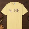 rise-tee-butter-front Rise design on a Butter Comfort Colors 1717 tee, laid flat
