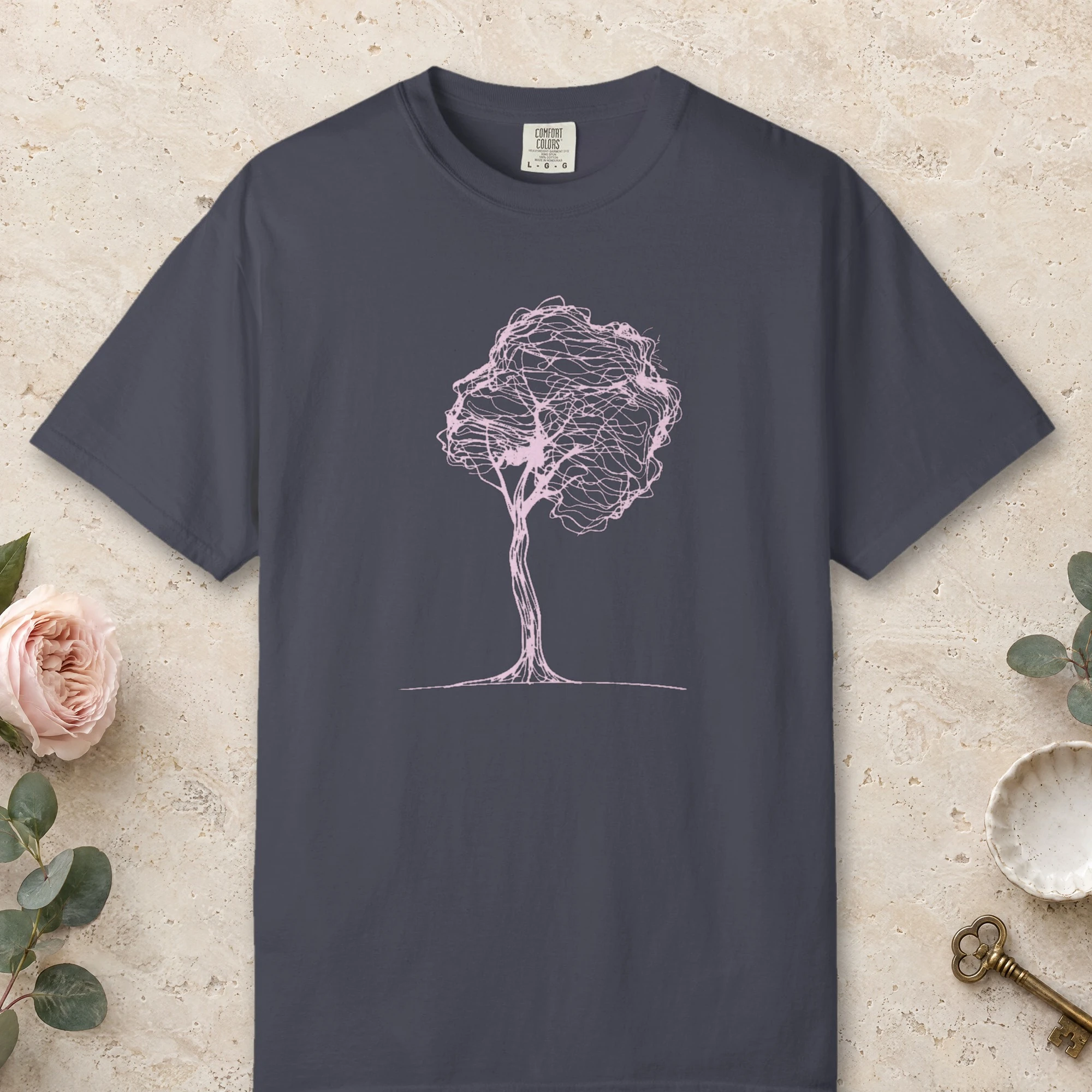 Round Crown Tree design on a Navy Comfort Colors 1717 tee, laid flat